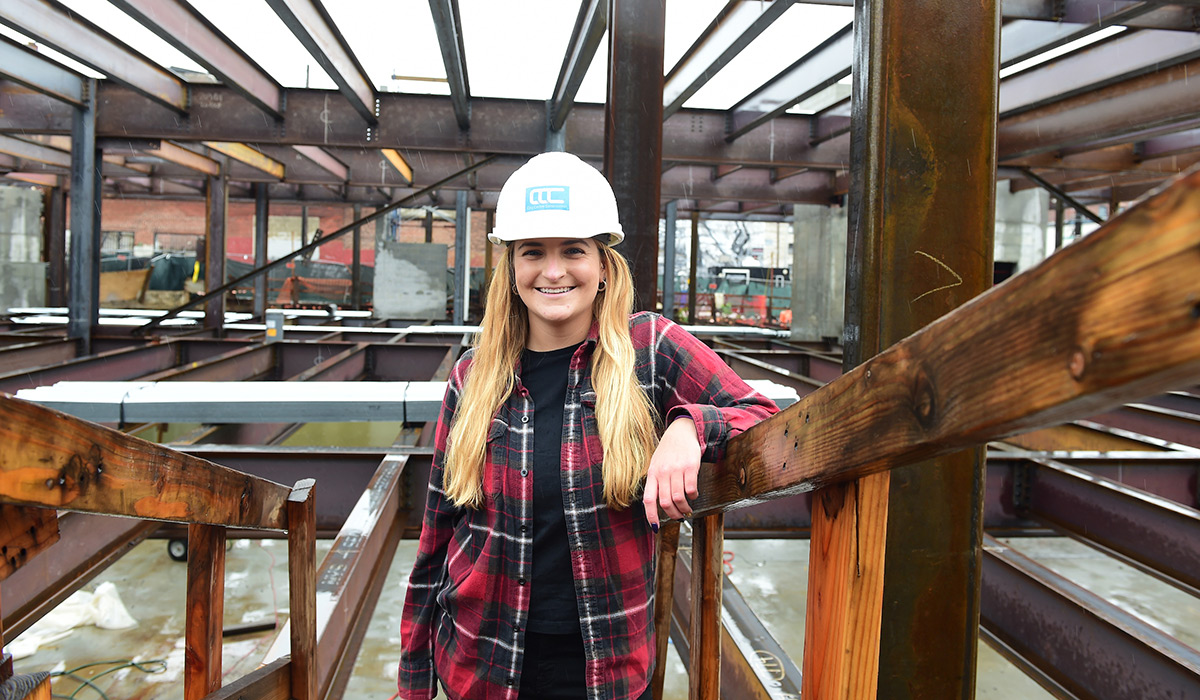 Female engineering alumna at a construction site